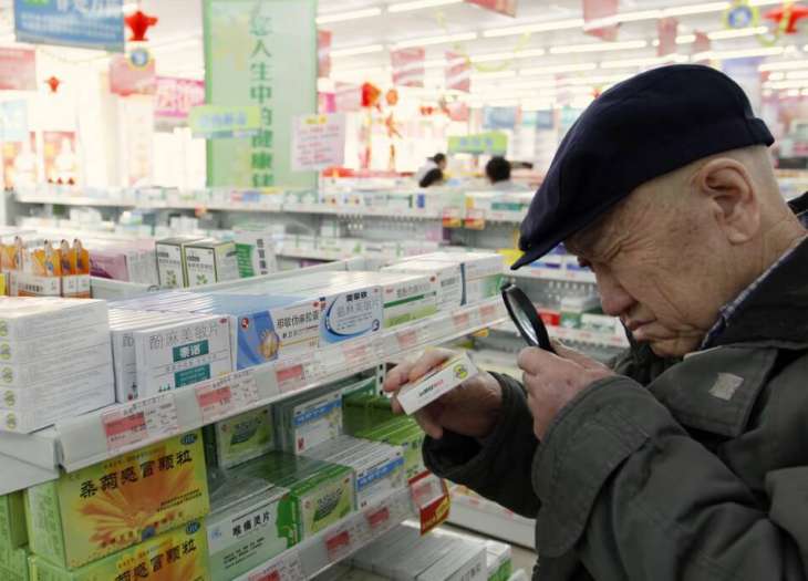 man shopping for modalert brand modafinil at a pharmacy in beijing china